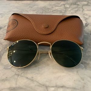 Round black and gold Ray Ban rb3447